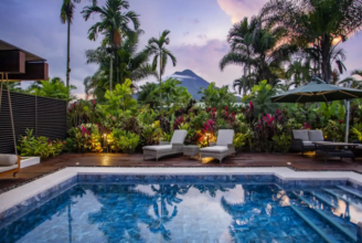 Luxury villa pool with Arenal Volcano view at Arenal Manoa Hot Springs Resort